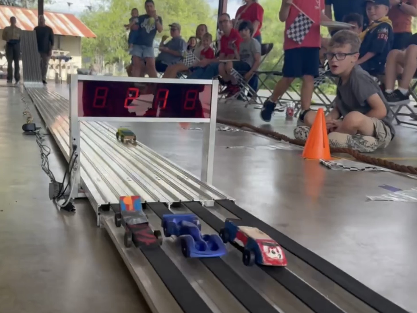 Scouts racing Pinewood Derby cars